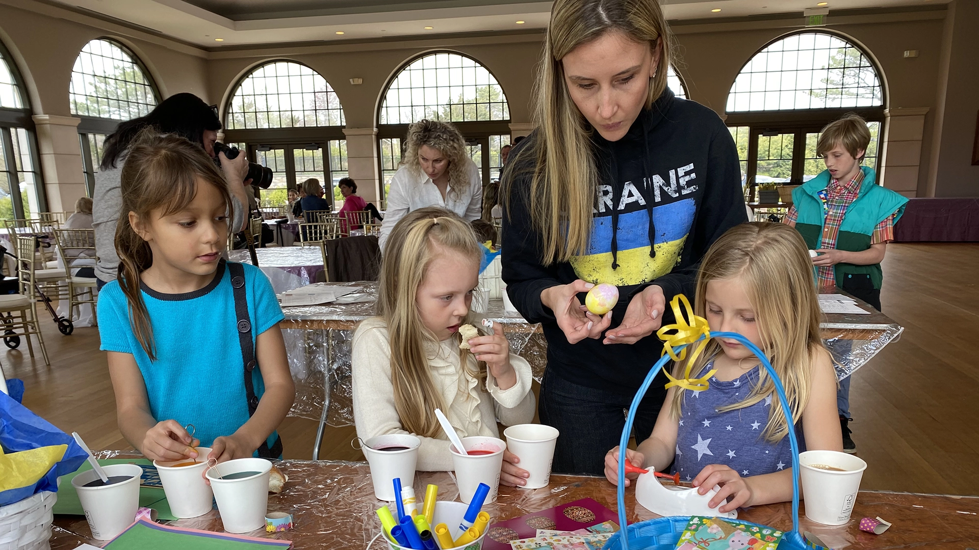 iLoveUkraine board member, Brittney Epley, coloring Ukrainian Easter eggs with six year olds at the Greek Orthodox church..