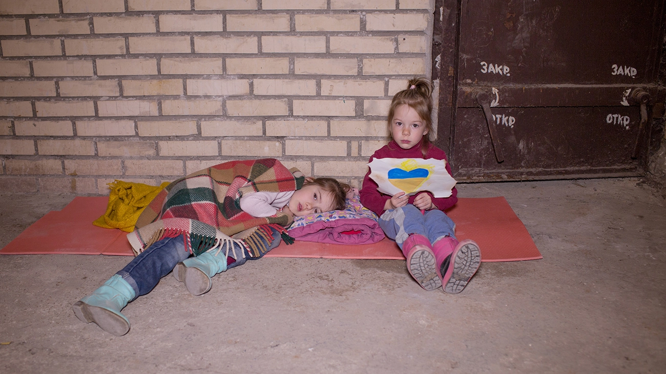 Two Ukrainian girls in a basement bomb shelter