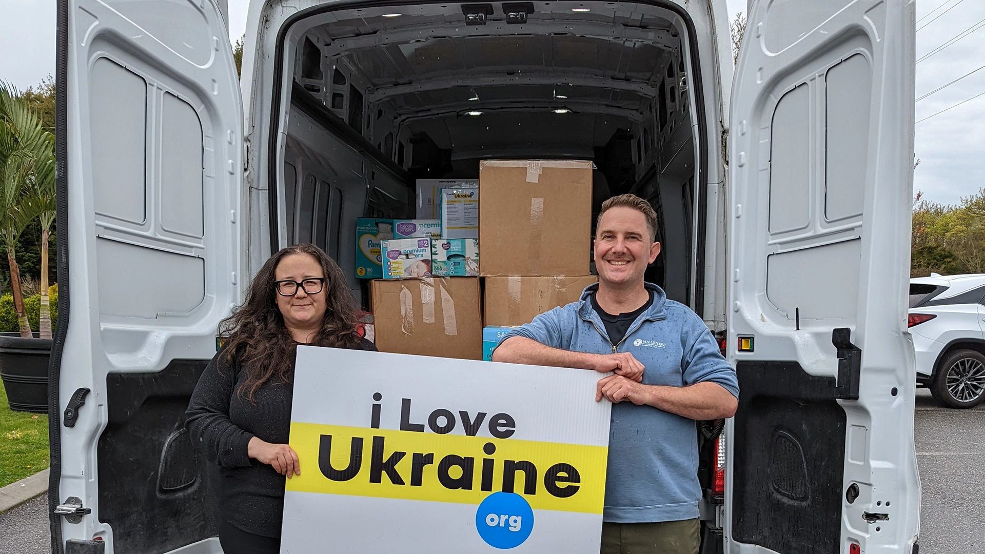 Volunteers and corporate partners Chris Murphy and Kate with a 2,000 lb. truckload of hygiene supplies for Ukraine.